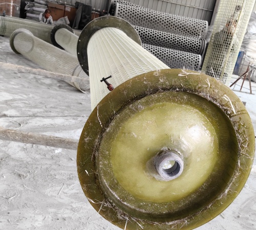 Technical diagram showing fiberglass inner cage structure for mist eliminator. Cylindrical perforated cage with support framework and mounting points.